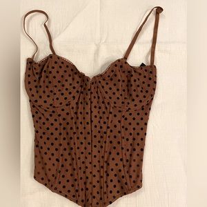Corset top with front closure and toes in back